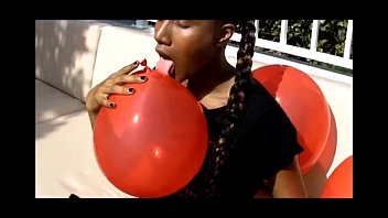 goddess jasmine plays with balloons outside