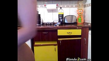blond woman bare in the kitchen